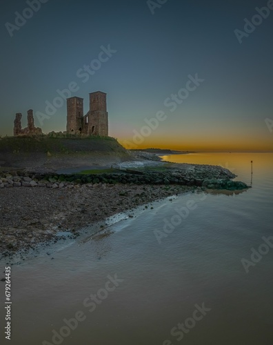 View of Historic Reculver Towers at sunset. Kent  England