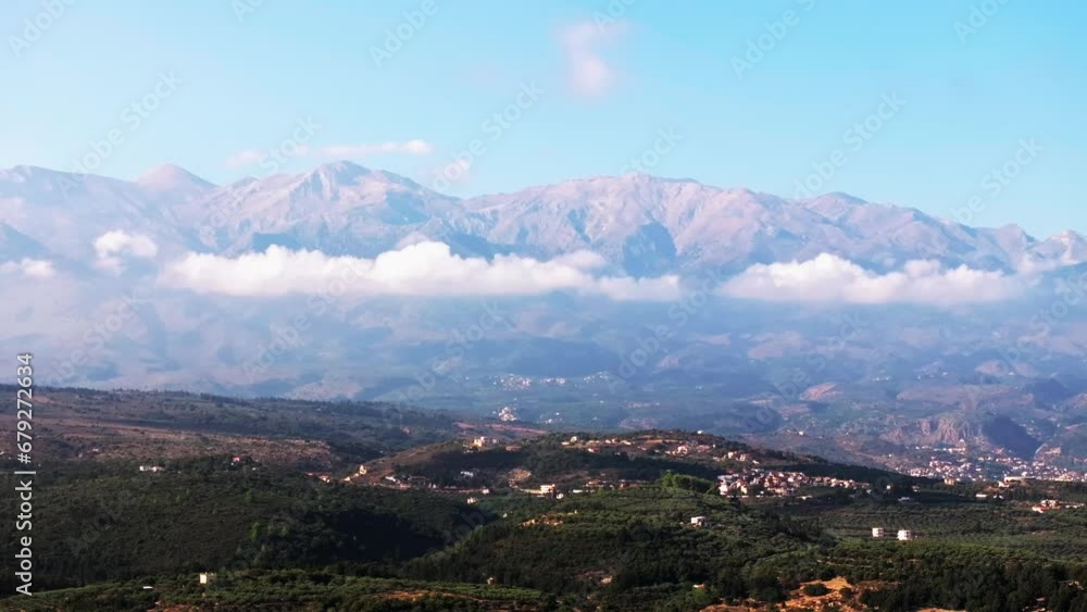 Mountain Aerial view of Crete island, Greece. Mountain landscape, olive groves and vineyards at sunset. Aerial video flying over the southern Aegean Sea with a view of Oia, Santorini, Greece, sunrise Mountain Aerial view of Crete island, Greece. Mountain landscape, olive groves and vineyards at sunset. Aerial video flying over the southern Aegean Sea with a view of Oia, Santorini, Greece, sunrise
