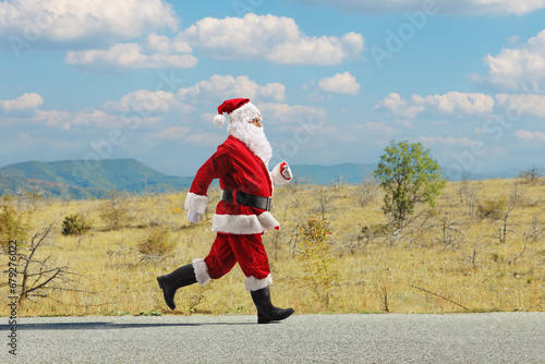Santa Claus running on a road