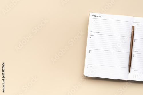 planner with the first week of January 2024 on a beige background photo