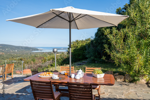 table, chair, umbrella
