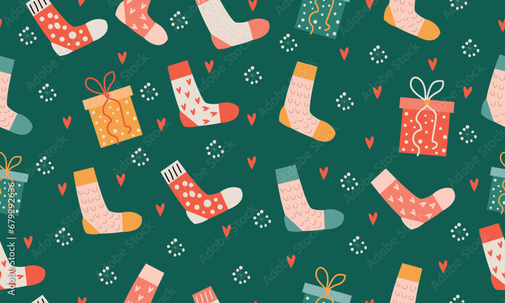 Seamless pattern with bright Christmas socks on a green background.