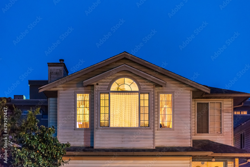 Fragment of a house with nice window at night Fragment of a house with nice window at night