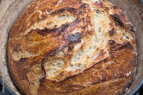 Tableau sur toile rustic no knead sourdough bread in a pot with towel (cast iron dutch oven, cover