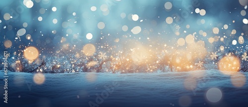 blue christmas background with frost and snowflakes and lots of out of focus bokeh with room for text.