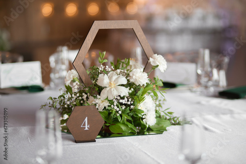 Luxury wedding table setting with flower centerpieces and candles