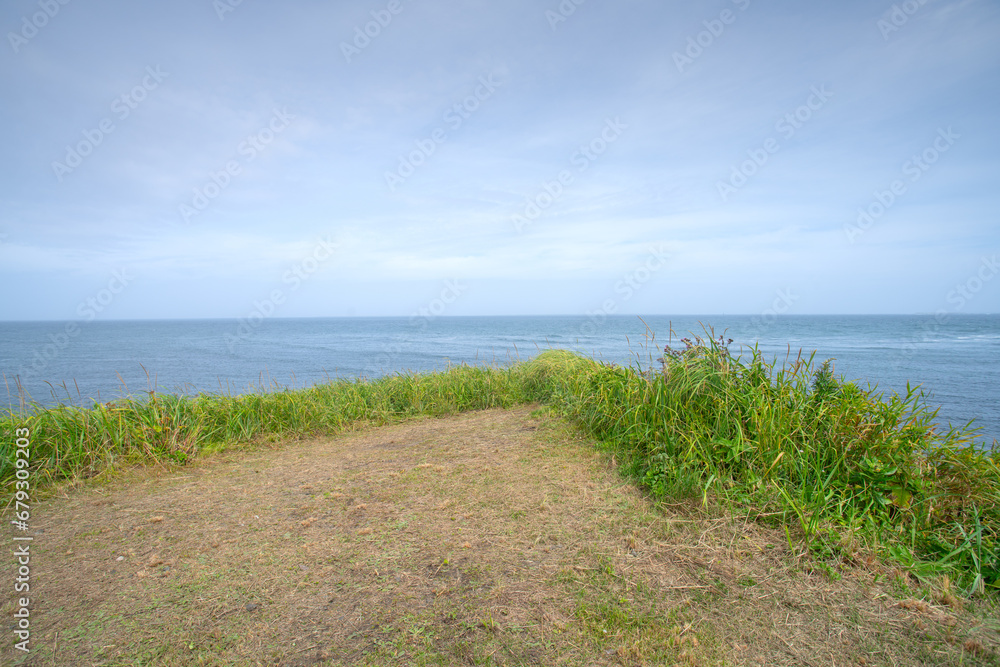 Cape Nosappu, the easternmost point in Hokkaido, and also in Japan, on Nemuro Peninsula, where the waters from Pacific Ocean meet Sea of Okhotsk, Nemuro, Hokkaido, Japan Cape Nosappu, the easternmost point in Hokkaido, and also in Japan, on Nemuro Peninsula, where the waters from Pacific Ocean meet Sea of Okhotsk, Nemuro, Hokkaido, Japan