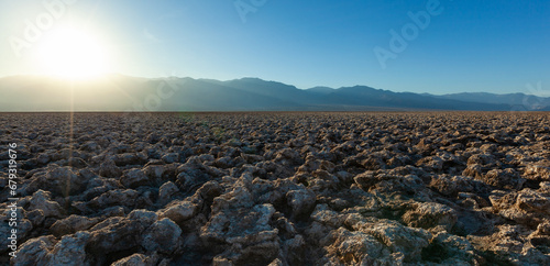 Salt desert, cracked crystalline salt. Dry cracked earth in Salt Flats, Death Valley