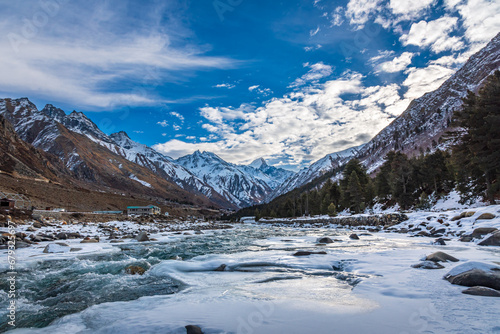 Serene Landscape of frozen Baspa river valley near Chitkul village in Kinnaur district of Himachal Pradesh  India. It is the last inhabited village near the Indo-China border.