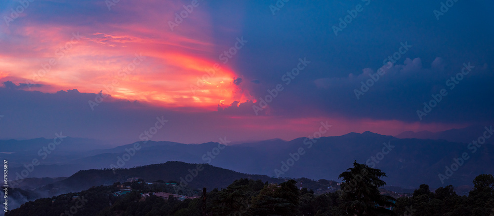 Mesmerizing view of cloudy red sunset sky background during sunset from Dalhousie, Himachal Pradesh, India.