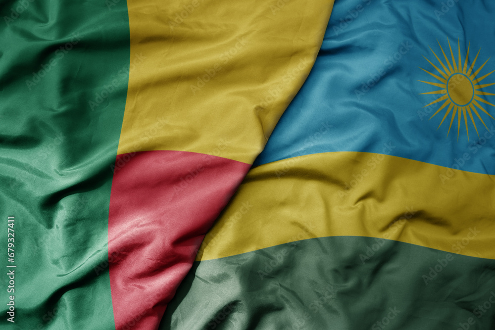 big waving national colorful flag of benin and national flag of rwanda . big waving national colorful flag of benin and national flag of rwanda .