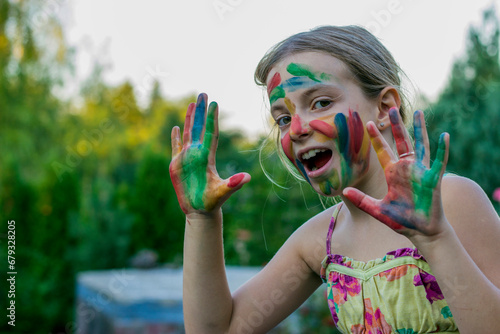 Cute little girl with painted hand