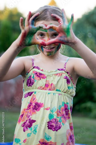 Cute little girl with painted hand