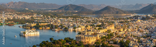 Panoramic aerial view of Udaipur city also known as city of lakes from Karni Mata Temple, Rajasthan. Udaipur city is a popular honeymoon destination among tourist in India. photo