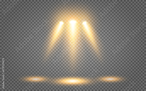 Lighting of the stage with three yellow beams of spotlights on a transparent background. Glowing transparent lighting effects. Vector illustration.