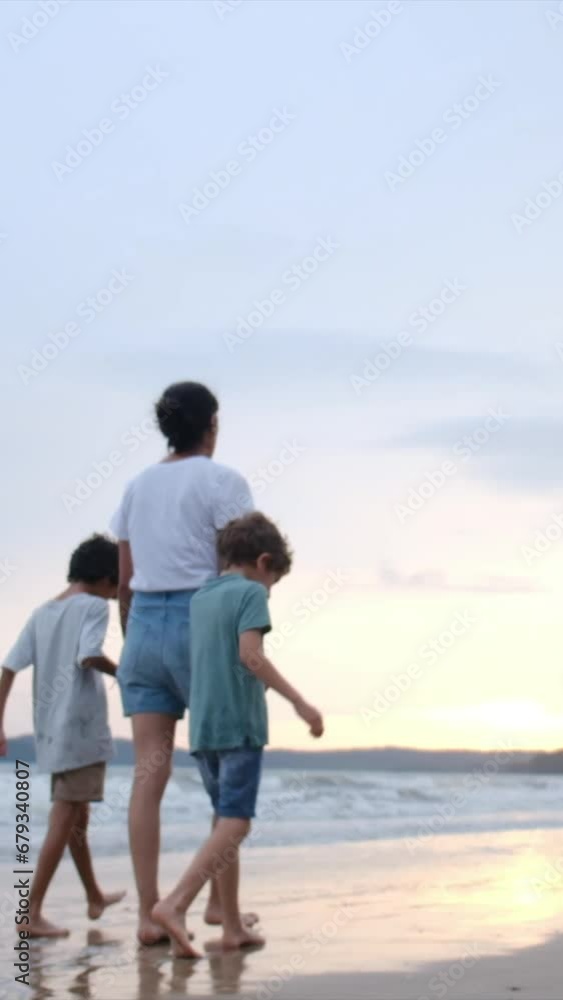 Immerse yourself in the enchantment of a beachside sunset with a joyful family—mom, kids, and dad—casting magical silhouettes, reaching for the sun. Witness the realization of children's dreams Immerse yourself in the enchantment of a beachside sunset with a joyful family—mom, kids, and dad—casting magical silhouettes, reaching for the sun. Witness the realization of children's dreams