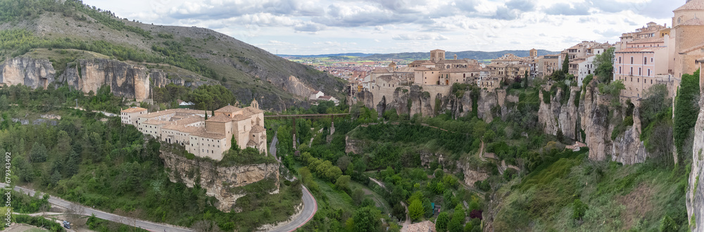 Panoramic view at the Cuenca Hanging Houses, Casas Colgadas, iconic buildings on the edge at the cliffs, on city touristic downtown, Cuenca downtown, Spain