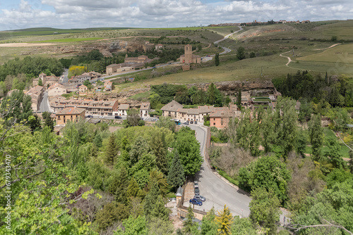 View at the Segovia surrounding city, pictoresque landscape with vegetation, houses and road, St João convent and Vera Cruz church, Segovia, Spain