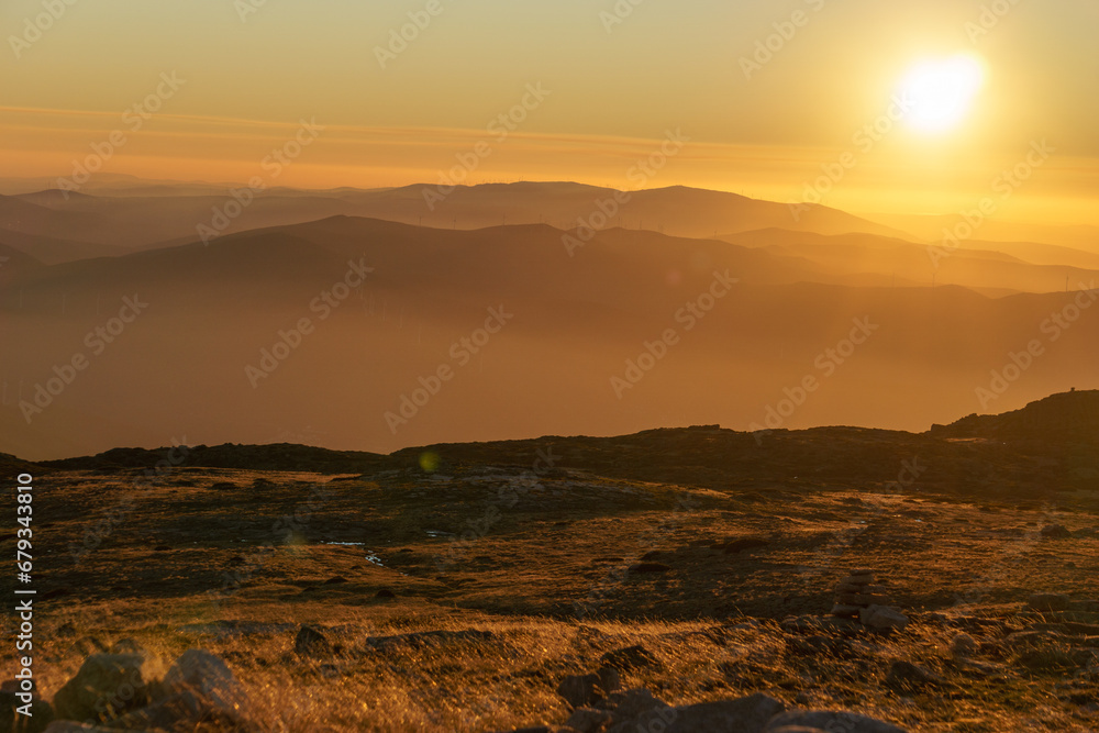 Beautiful golden sunset seen from Torre mountain peak of Serra da Estrela, Portugal