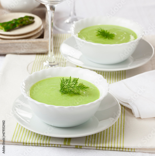 Green asparagus cream decorated with wild dill