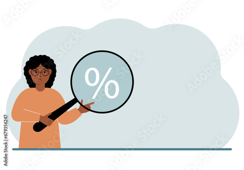 A woman shows a percent sign through a magnifying glass.