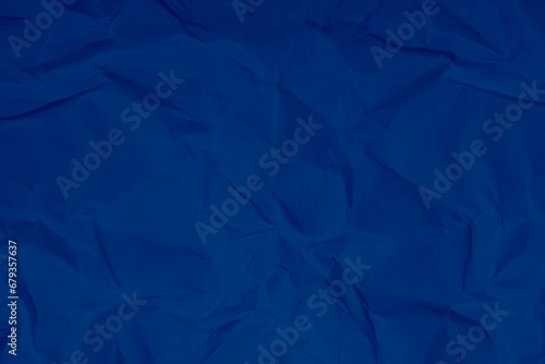 blue crumpled sheet of paper, grunge texture background blue crumpled paper photo