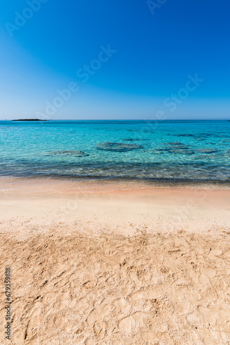 Beautiful view of Elafonisi Beach, Chania. The amazing pink beach of Crete. Elafonisi island is like paradise on earth with wonderful beach with pink coral and turquoise waters.