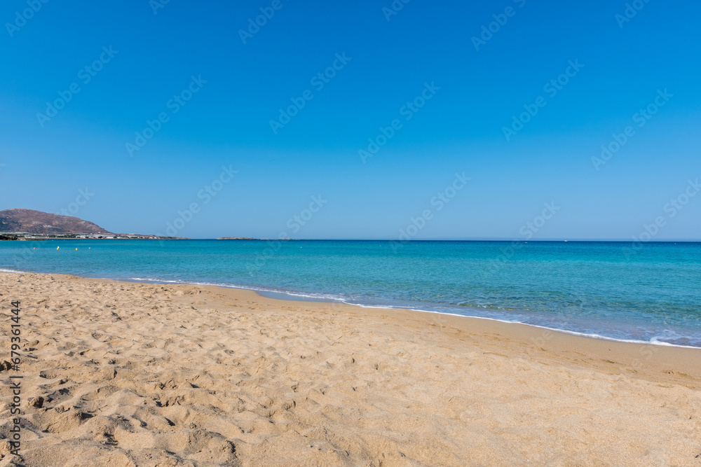 View of the sea in the Island with sandy beach, cloudless and clear water. Tropical colours, peace and tranquillity. Turquoise sea. Falasarna beach, Crete island, Greece.