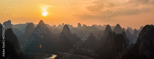 Panoramic landscape sunset scene view from Laozhai mountain on the karsten hills in Guilin, Guangxi,China photo