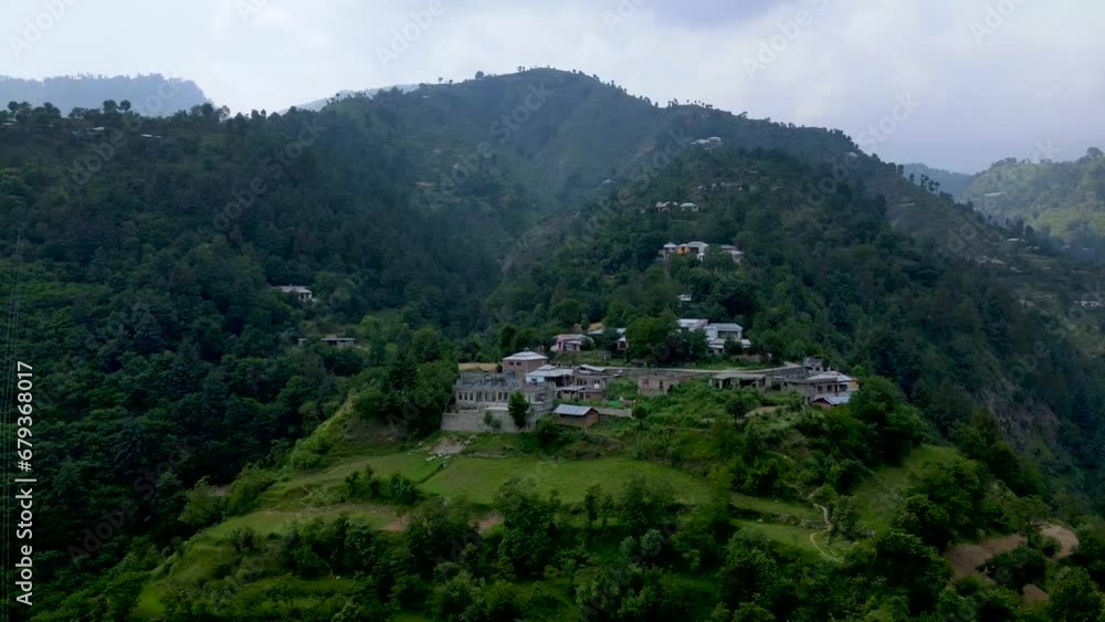 Arial shot of hill station with road and river in Pakistan Arial shot of hill station with road and river in Pakistan