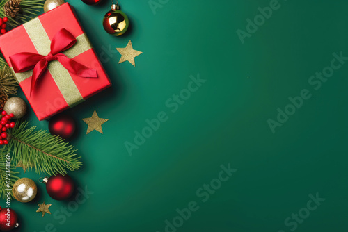 Christmas balls, presents and golden stars on green background