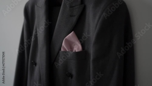 Close up footage of pocket square  handkerchief in the breast pocket of a man's festive suit. photo