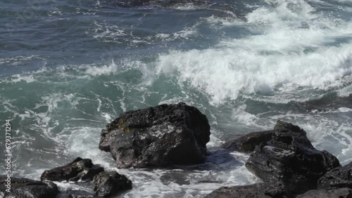 slow motion waves crashing into lava rocks maui hawaii (ID: 679371294)