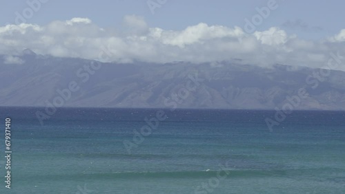 Slow motion waves with Molokai in background from Maui (ID: 679371410)