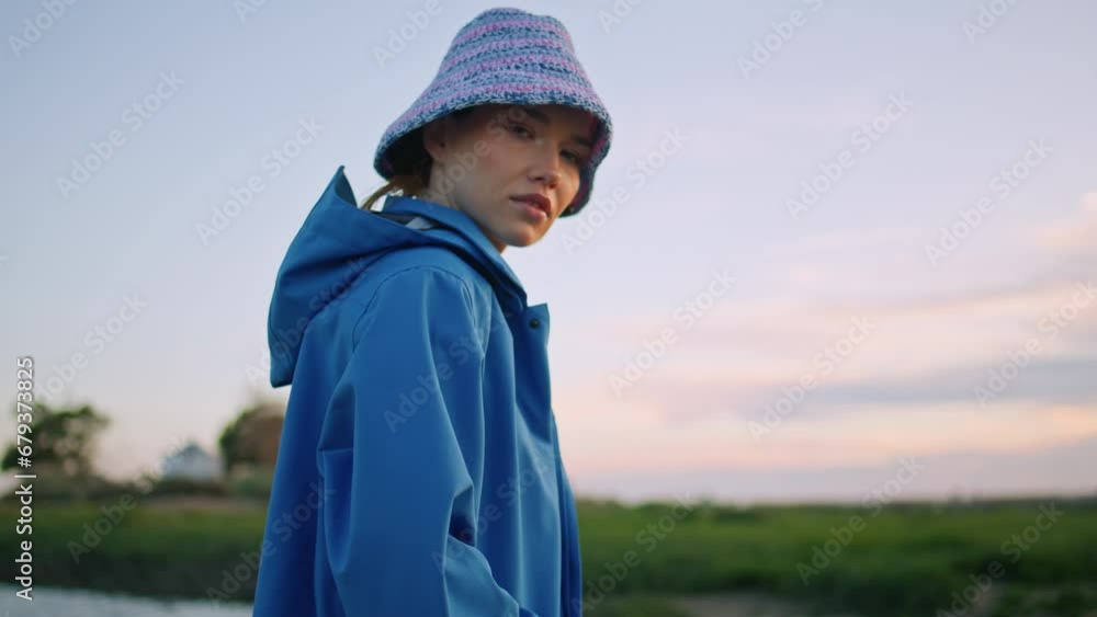 Pretty woman posing river bank in evening. Beautiful traveler holding scoop net Pretty woman posing river bank in evening. Beautiful traveler holding scoop net