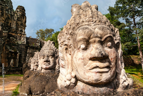 South gate of Angkor Thom along with a bridge of statues of gods and demons. Two rows of figures each carry the body of seven-headed naga. Angkor  Siem Reap province  Cambodia  Asia