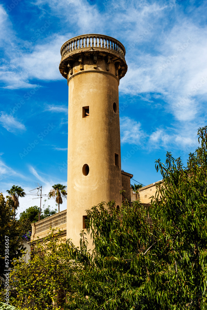 Historic watchtower in a garden in the Clota neighborhood, Barcelona, Catalonia, Spain, Europe