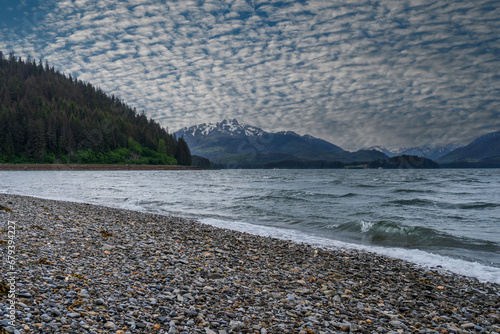 Icy Strait Point, Hoonah, Alaska. Rocky shore of Chichagof Island and bay.  photo