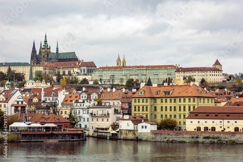 a view of prague with the charles bridge in front of it