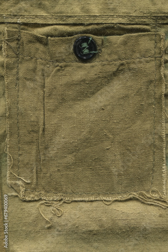 fragment pocket. old khaki cotton canvas. texture. vintage fabric.