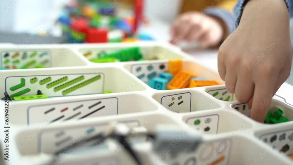 Robotics programming class. Children construct and code Robot. STEM ...