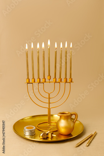 Jewish religious holiday Hanukkah with holiday Hanukkah (traditional candelabra) and dreidel. Golden baner