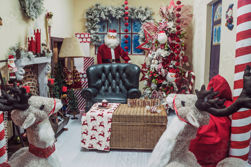  A colorful, joyful scene adorned with a Santa statue, plush sofa, and charming stuffed animals. Perfect for holiday-themed projects. © Alfredo Juarez