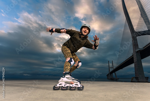 Roller skating teen in outdoors rollerblading on inline skates. Caucasian young girl in outdoor activities.