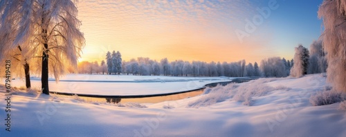 panoramic view of a snow-covered golf course at sunrise, with frosty trees and a peaceful, undisturbed landscape photo