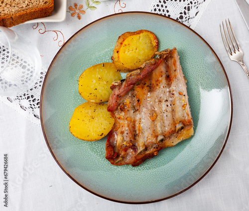 Ccostillas de cerdo - pork ribs with boiled potatoes. Spanish cuisine