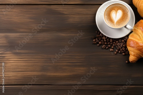 cup of coffee on table with copy space and heart latte art and croissant 