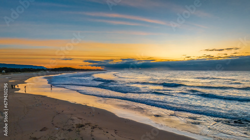 Sunrise seascape with waves © Merrillie