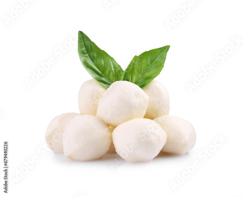 Tasty mozzarella balls and basil leaves isolated on white photo