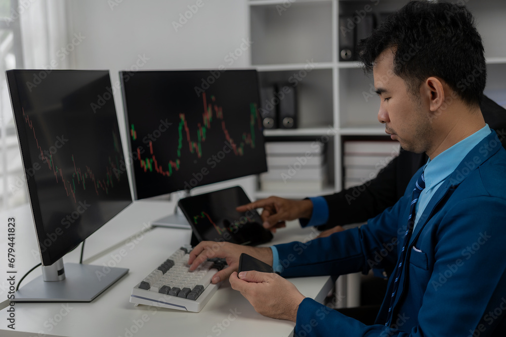 Forex traders Man in front of multiple computer monitors Automated computer monitor of business processes from financial stock analysis data graphs. Forex traders Man in front of multiple computer monitors Automated computer monitor of business processes from financial stock analysis data graphs.